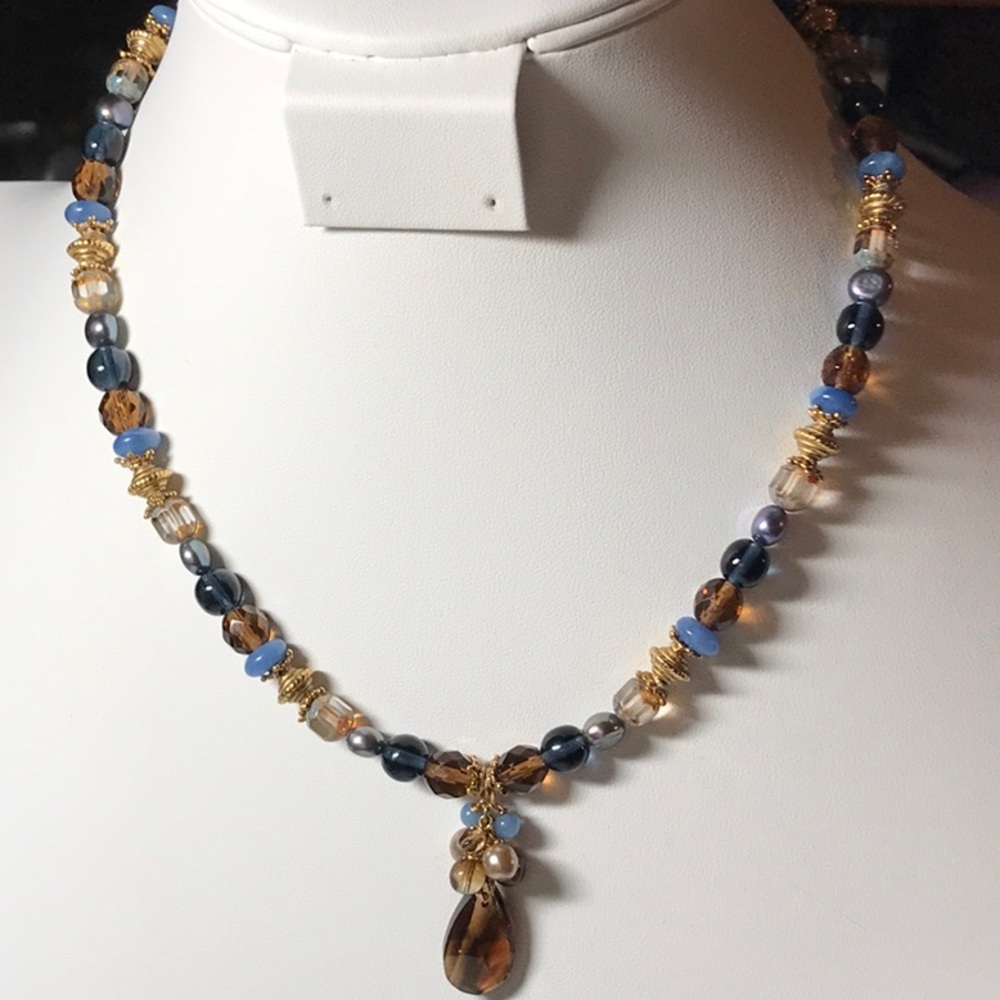 glass beaded necklace in blues and amber tones